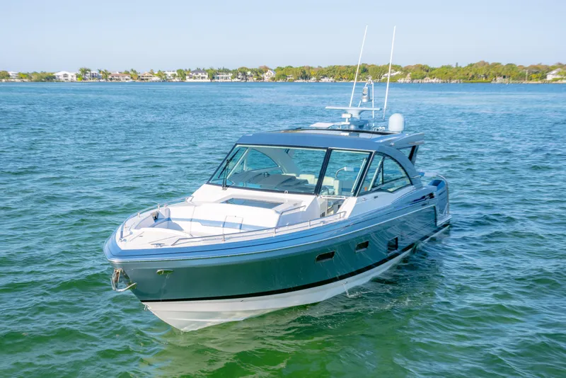 Slide: The Image of 2025 Formula 430 Super Sport Crossover yacht cruising on clear blue water. - 90