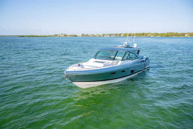 Slide: The Image of 2025 Formula 430 Super Sport Crossover yacht cruising on clear blue water. - 91