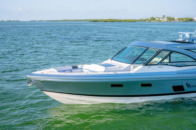 Slide: The Image of 2025 Formula 430 Super Sport Crossover cruising on clear blue waters. - 93