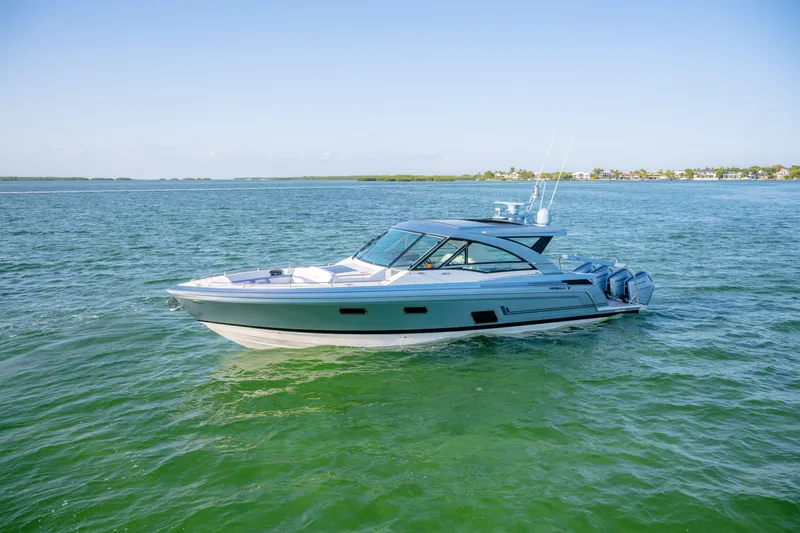 Slide: The Image of 2025 Formula 430 Super Sport Crossover cruising on clear blue waters. - 94