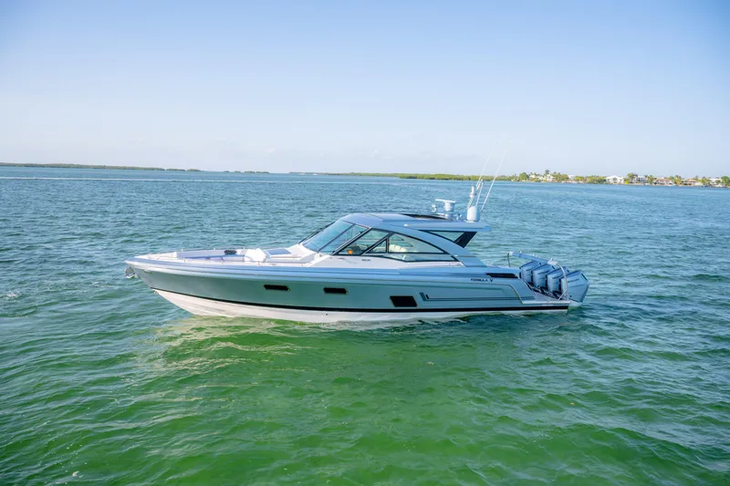 Slide: The Image of 2025 Formula 430 Super Sport Crossover boat cruising on open water. - 96
