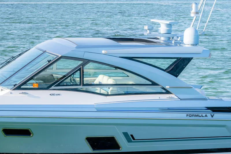 Slide: The Image of 2025 Formula 430 Super Sport Crossover yacht on water, showcasing sleek design and modern features. - 97