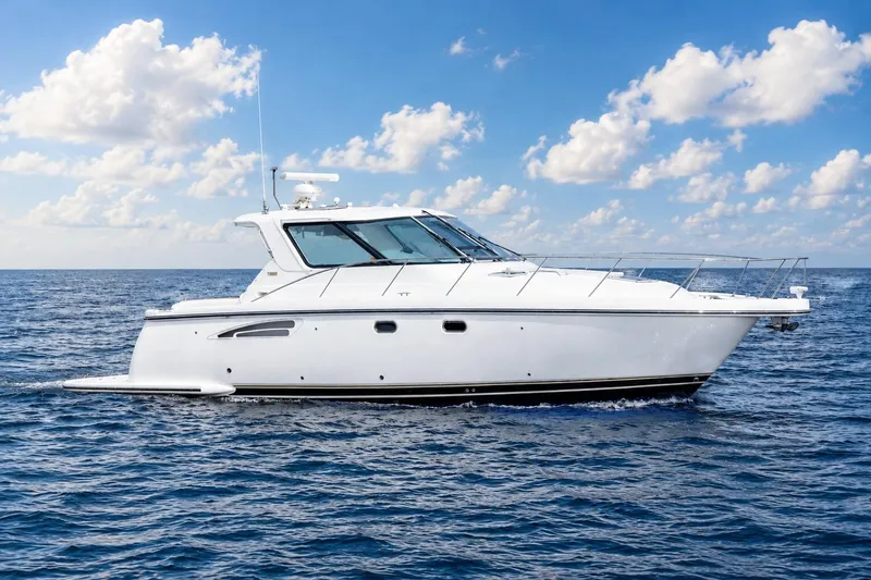 The Image of 2004 Tiara Yachts 3600 Sovran cruising on open water under a clear sky. - 0
