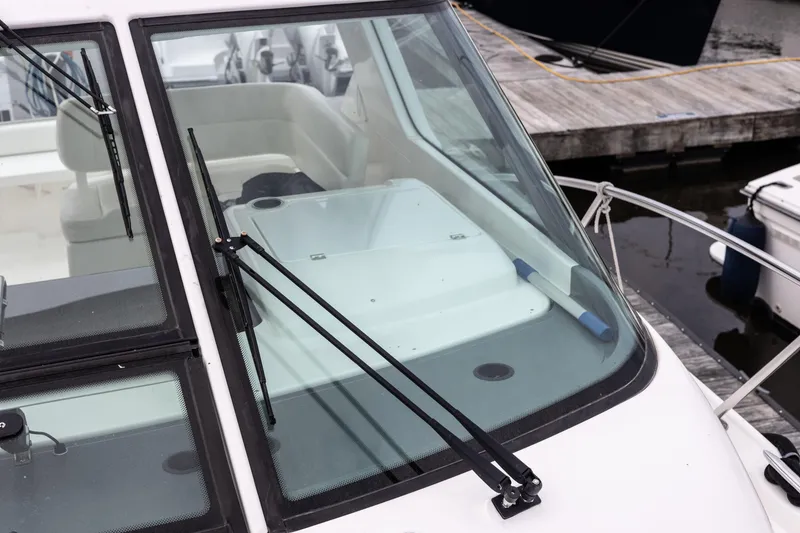 Slide: The Image of 2004 Tiara Yachts 3600 Sovran boat windshield and wipers at dockside. - 16