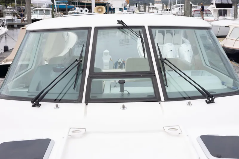 Slide: The Image of 2004 Tiara Yachts 3600 Sovran boat windshield with wipers at marina. - 17