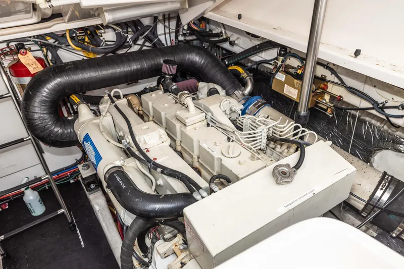 Slide: The Image of Engine room of a 2004 Tiara Yachts 3600 Sovran, showcasing mechanical components. - 18