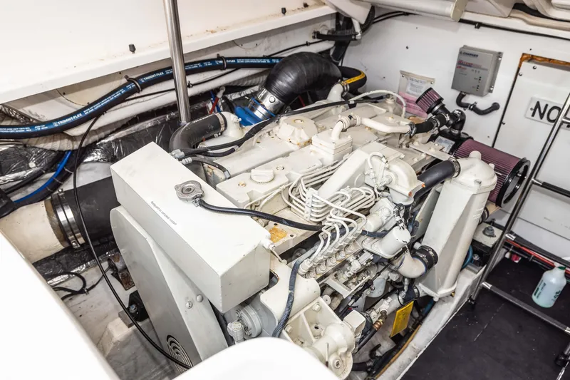 Slide: The Image of Engine room of a 2004 Tiara Yachts 3600 Sovran, showcasing detailed mechanical components. - 19