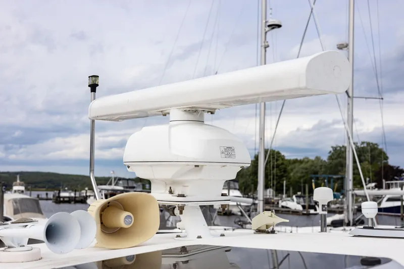 Slide: The Image of Radar equipment on a 2004 Tiara Yachts 3600 Sovran, docked at a marina. - 23