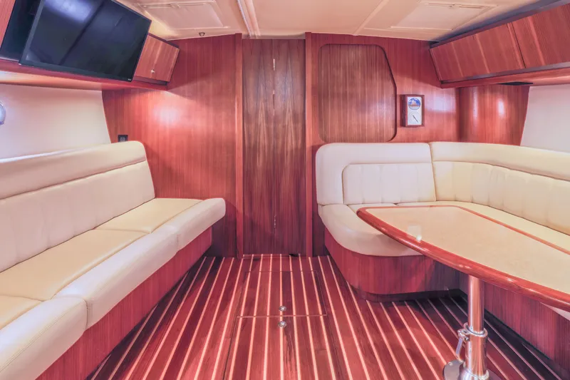 Slide: The Image of Luxurious interior of 2004 Tiara Yachts 3600 Sovran with elegant wood finish and plush seating. - 3