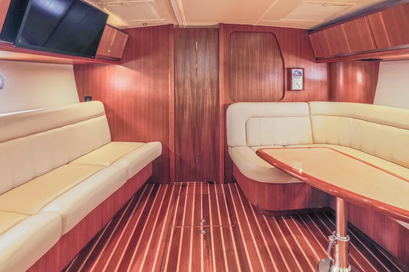 Slide: The Image of Luxurious interior of 2004 Tiara Yachts 3600 Sovran with elegant wood finish and plush seating. - 6