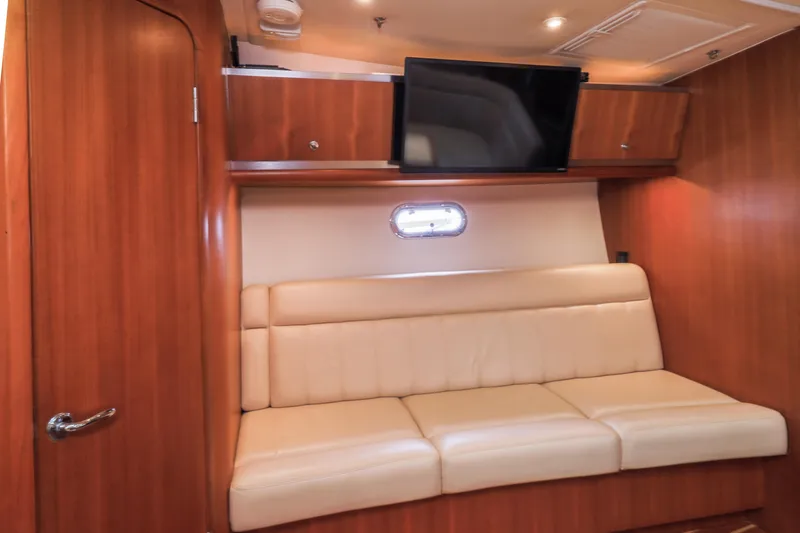 Slide: The Image of Luxurious interior of 2004 Tiara Yachts 3600 Sovran with leather seating and mounted TV. - 7