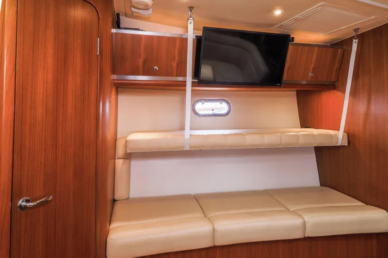 Slide: The Image of Luxurious interior of 2004 Tiara Yachts 3600 Sovran with leather seating and mounted TV. - 9