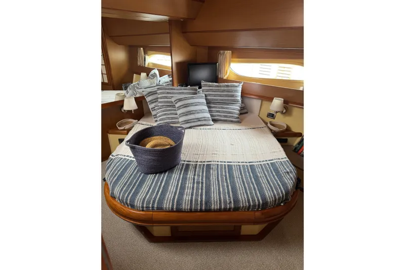 Slide: The Image of Luxurious cabin interior of 2009 Mochi Craft 44 Dolphin yacht with cozy bedding. - 15