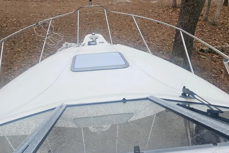 Slide: The Image of Anchor windlass and cleat on 2001 Maxum 2400 SCR boat deck. - 23