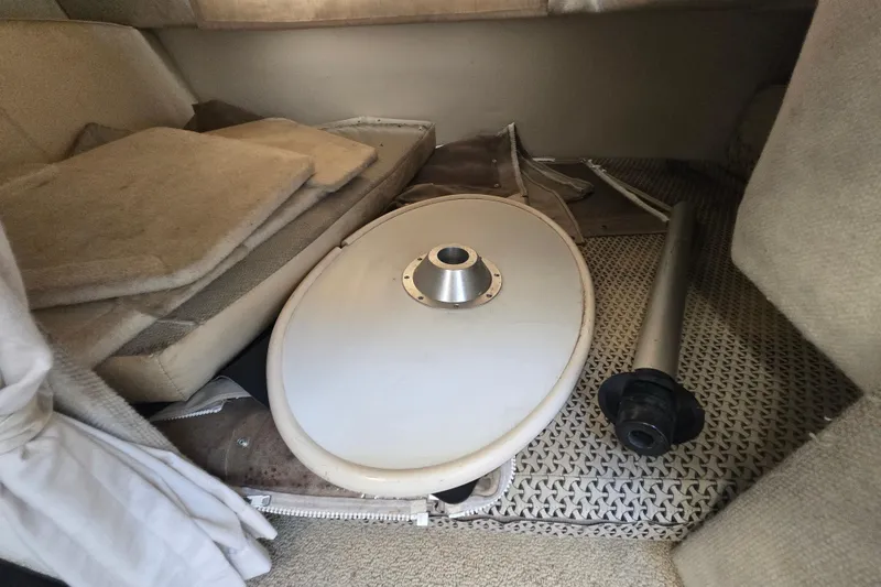 Slide: The Image of Interior of a 2001 Maxum 2400 SCR boat with table and cushions. - 24