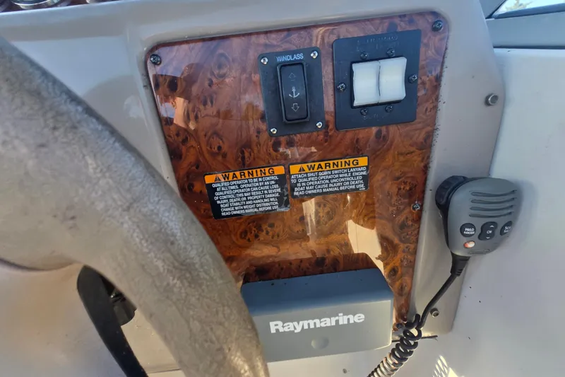 Slide: The Image of Control panel of a 2001 Maxum 2400 SCR boat with Raymarine equipment. - 26