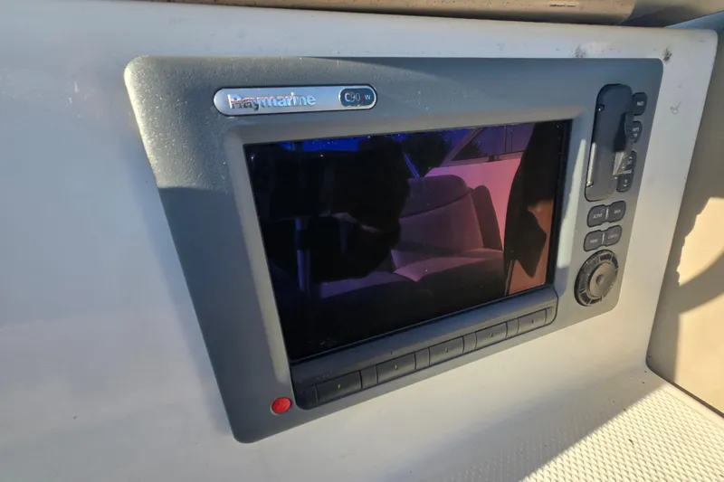 Slide: The Image of Raymarine C90W marine display on 2001 Maxum 2400 SCR boat dashboard. - 29