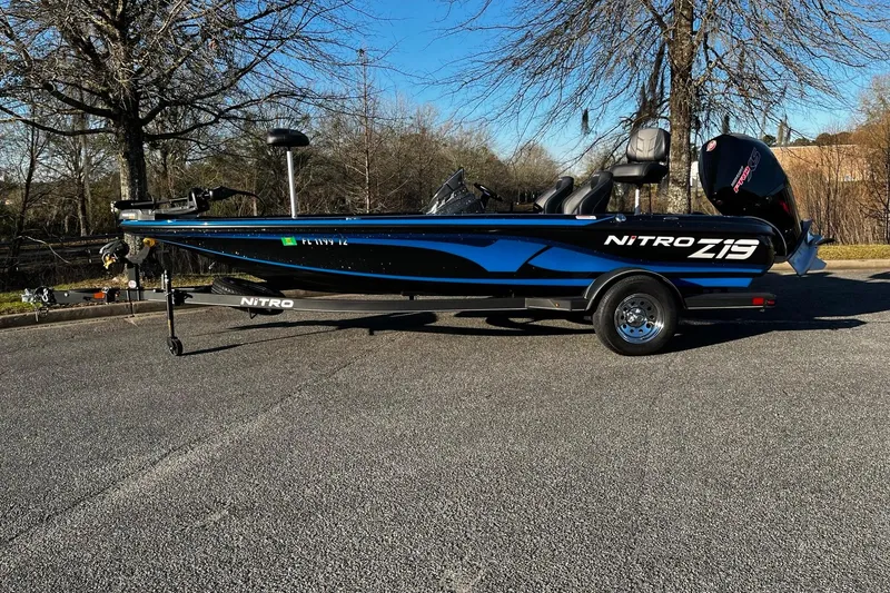 The Image of 2024 Nitro Z19 boat on trailer, parked outdoors, showcasing sleek design and modern features. - 1