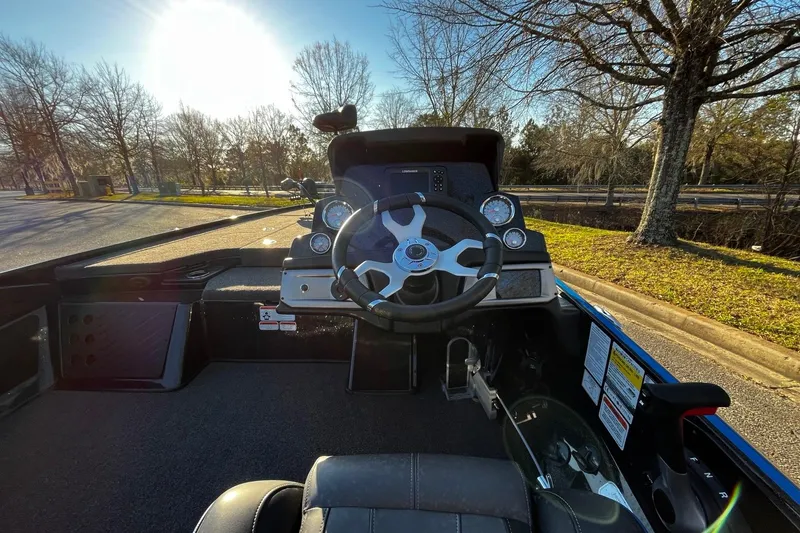 Slide: The Image of 2024 Nitro Z19 boat cockpit with steering wheel and dashboard controls. - 5