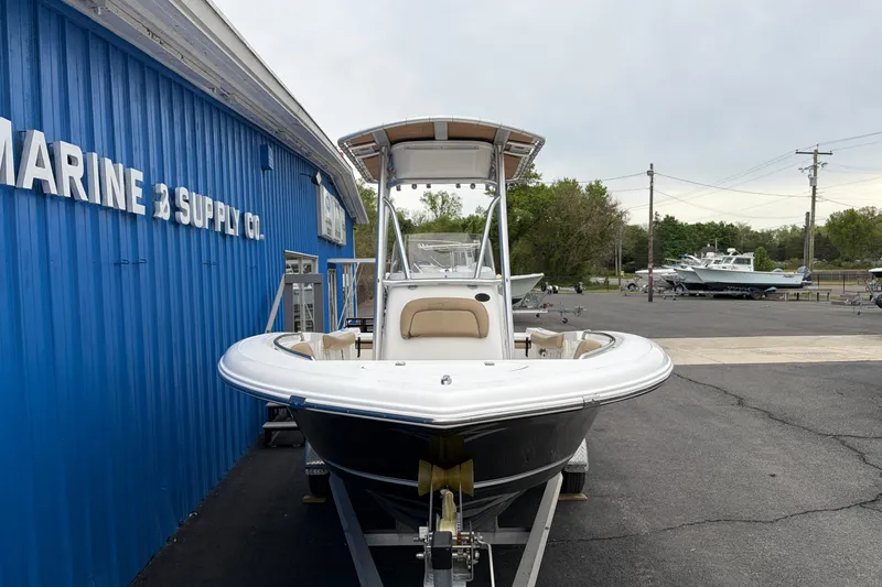 Slide: The Image of 2017 Tidewater 198 CC Adventure boat on trailer at marine supply store. - 1