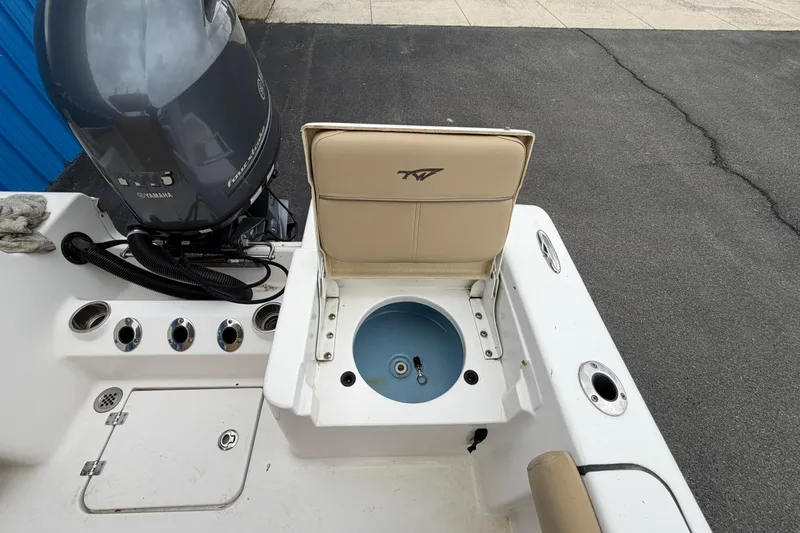 Slide: The Image of 2017 Tidewater 198 CC Adventure boat with Yamaha engine and open storage compartment. - 16