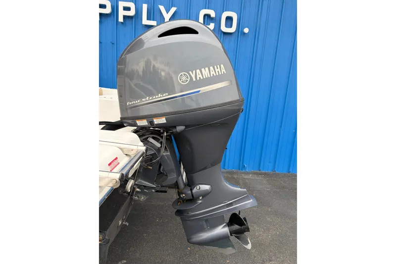 Slide: The Image of 2017 Tidewater 198 CC Adventure with Yamaha four-stroke outboard motor, blue background. - 20