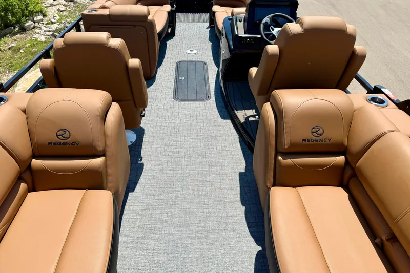 Slide: The Image of Luxurious interior of 2026 Regency 230 DL boat with tan leather seating and modern design. - 10