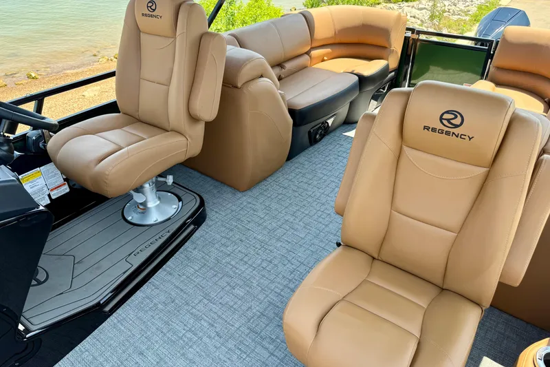 Slide: The Image of Luxurious interior of 2026 Regency 230 DL boat with tan leather seating. - 20