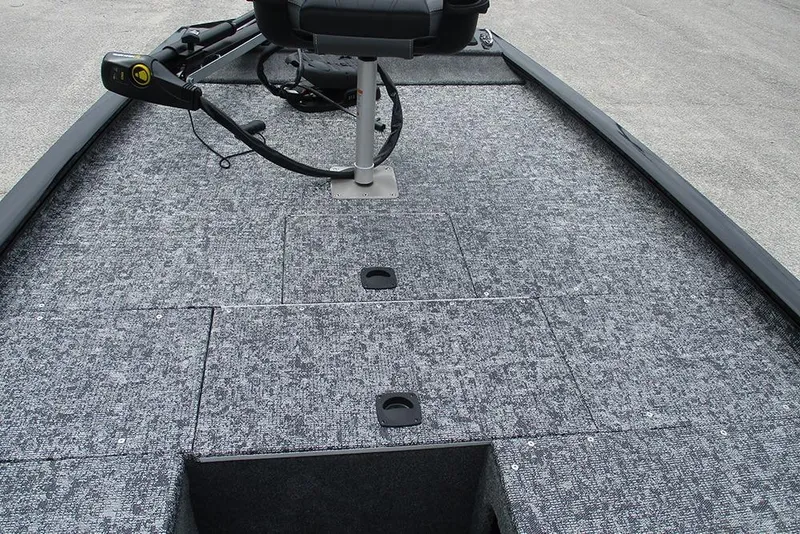 Slide: The Image of 2026 Tracker Pro 170 boat deck with carpeted surface and seating. - 10