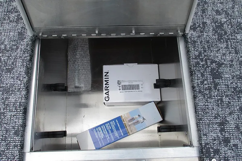 Slide: The Image of Storage compartment in 2026 Tracker Pro 170 boat with Garmin box inside. - 12
