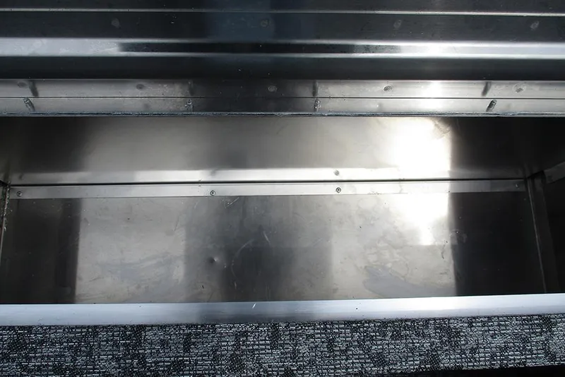 Slide: The Image of Storage compartment of 2026 Tracker Pro 170 boat, featuring metallic interior. - 17