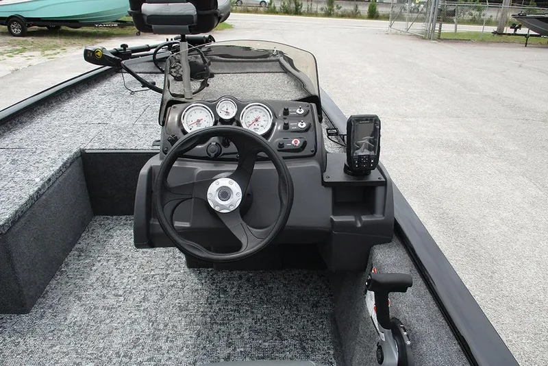 Slide: The Image of 2026 Tracker Pro 170 boat dashboard with steering wheel and gauges. - 18