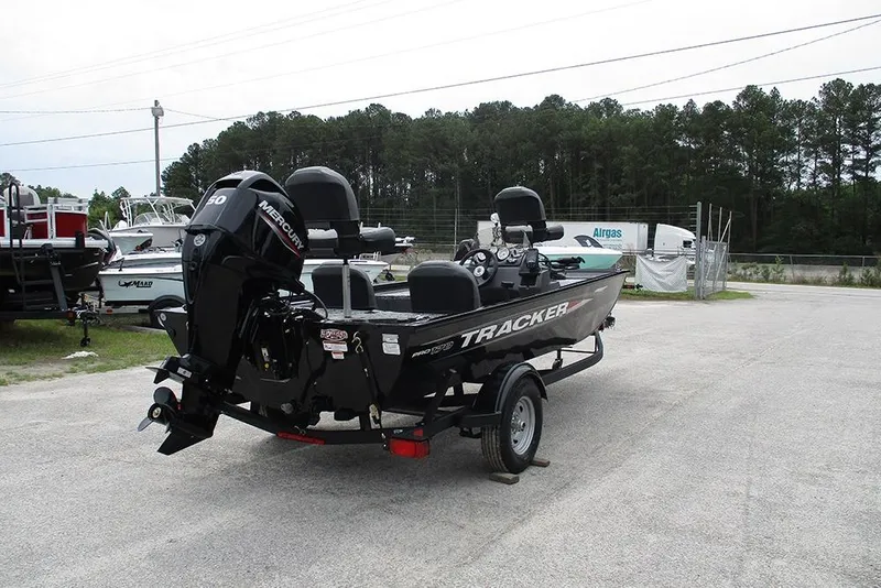 Slide: The Image of 2026 Tracker Pro 170 boat with Mercury engine on trailer in outdoor setting. - 6