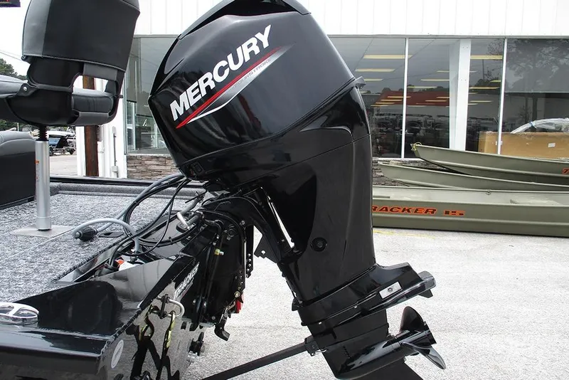 Slide: The Image of 2026 Tracker Pro 170 boat with Mercury outboard motor, displayed outdoors. - 8