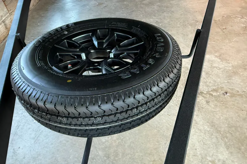 Slide: The Image of Spare tire mounted on a 2026 Tracker Bass Tracker Classic Limited trailer. - 14