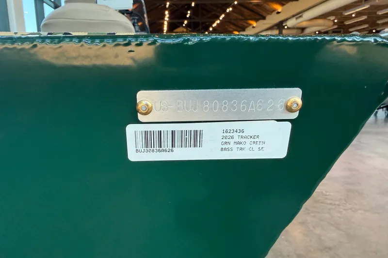 Slide: The Image of 2026 Tracker Bass Tracker Classic Limited, green hull with identification plate and barcode. - 17
