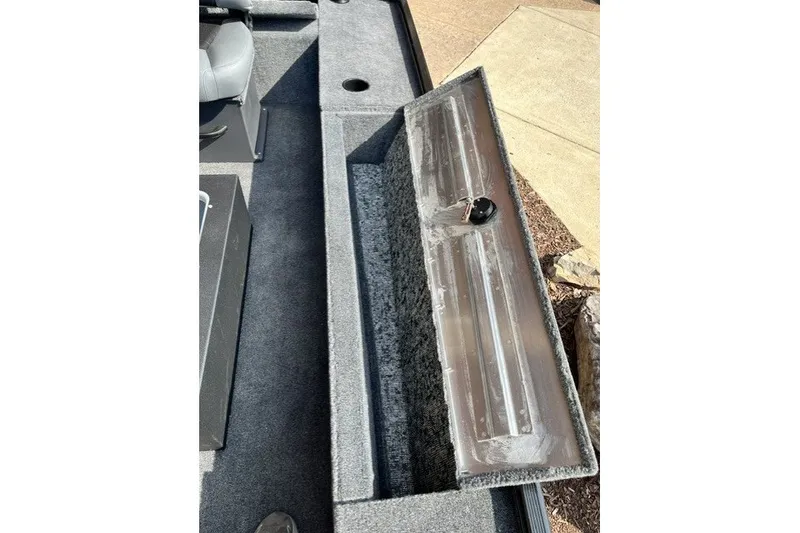 Slide: The Image of 2026 Tracker Panfish 17 boat interior with open storage compartment. - 43