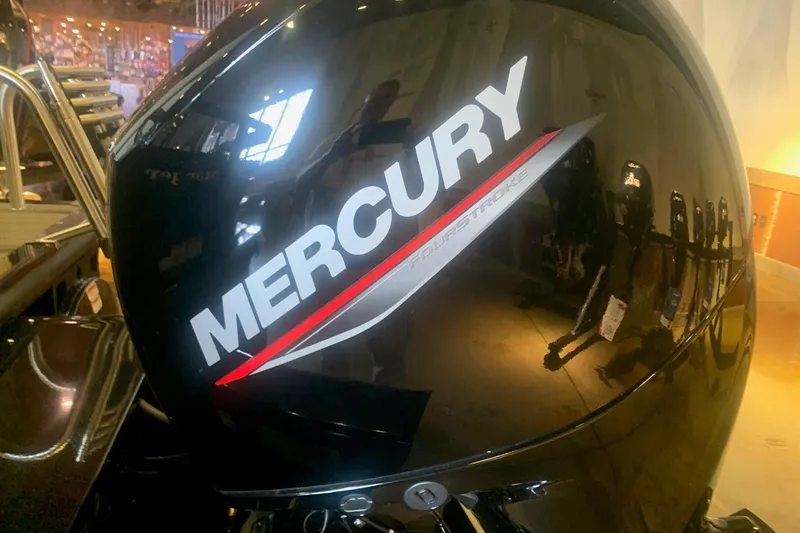 Slide: The Image of Mercury FourStroke engine on 2026 Ranger 223F boat, displayed indoors. - 3