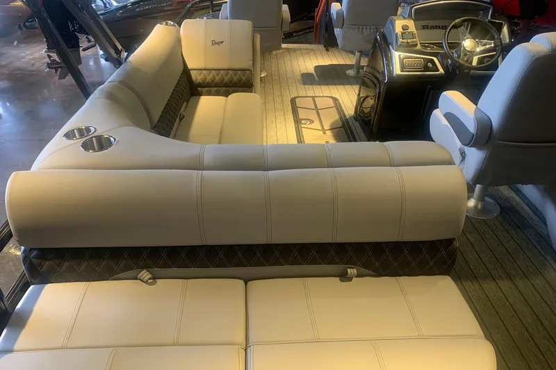 Slide: The Image of Luxurious interior of 2026 Ranger 223F boat with plush seating and modern dashboard. - 7