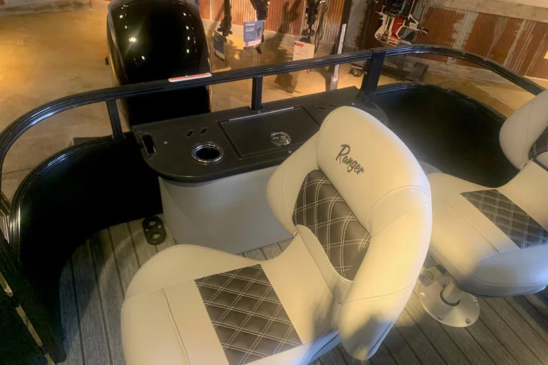 Slide: The Image of 2026 Ranger 223F boat interior with plush seating and sleek design. - 10