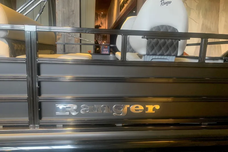 Slide: The Image of 2026 Ranger 223F boat interior with branded seating and sleek design. - 4