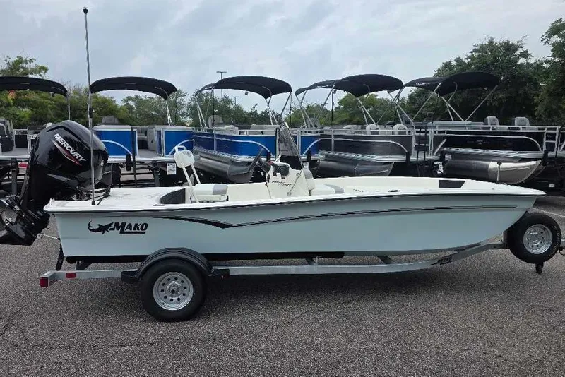 The Image of 2026 Mako Pro Skiff 17 CC boat on trailer, parked outdoors. - 0