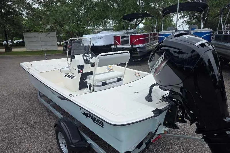 Slide: The Image of 2026 Mako Pro Skiff 17 CC boat with Mercury engine on trailer. - 4