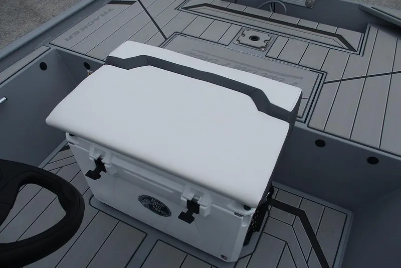 Slide: The Image of 2026 Tracker Bass Tracker Classic CC boat interior with cushioned seat and steering wheel. - 18