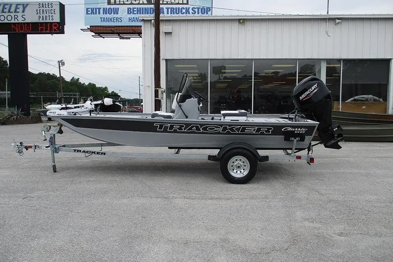 The Image of 2026 Tracker Bass Tracker Classic CC boat on trailer outside dealership. - 2