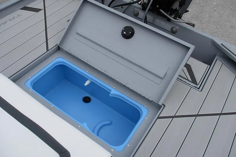 Slide: The Image of 2026 Tracker Bass Tracker Classic CC boat with open storage compartment and blue interior. - 22