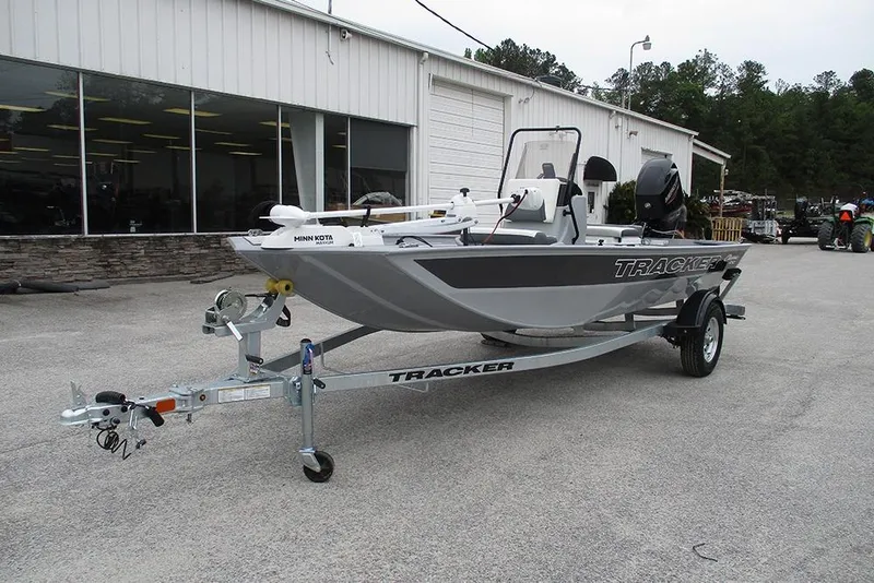 Slide: The Image of 2026 Tracker Bass Tracker Classic CC boat on trailer outside dealership. - 4