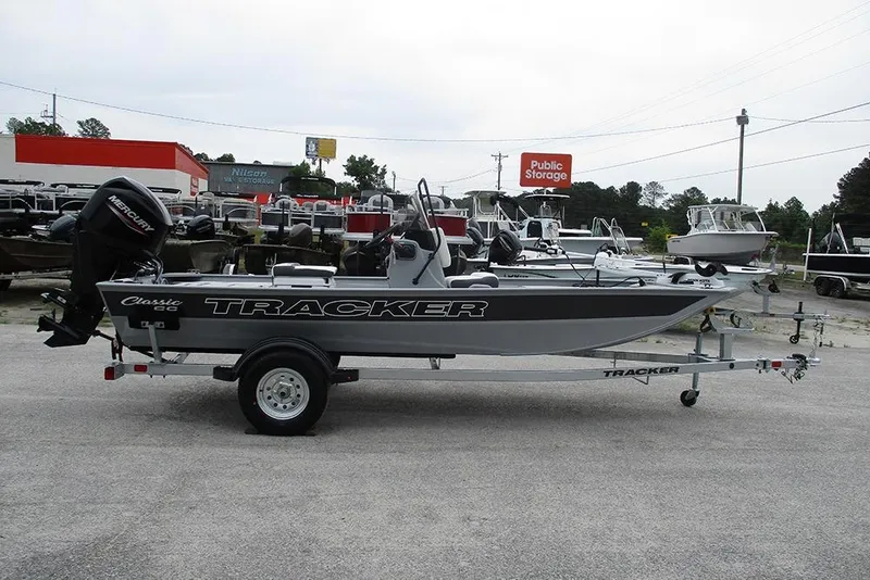 Slide: The Image of 2026 Tracker Bass Tracker Classic CC boat on trailer in outdoor storage area. - 7