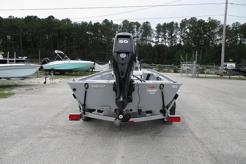 Slide: The Image of 2026 Tracker Bass Tracker Classic CC boat with 50 HP engine, parked outdoors. - 9