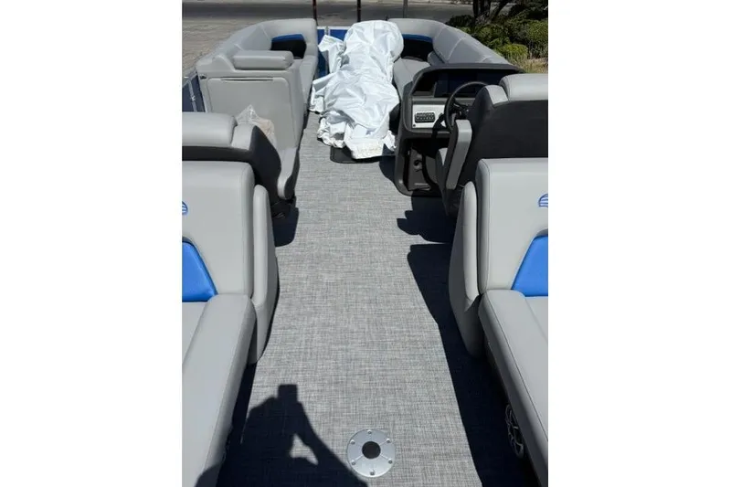 Slide: The Image of 2026 Sun Tracker Party Barge 24 XP3 interior with gray seating and blue accents. - 10